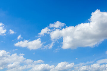 Obraz na płótnie Canvas Cirrus and cumulus clouds on blue sky background.