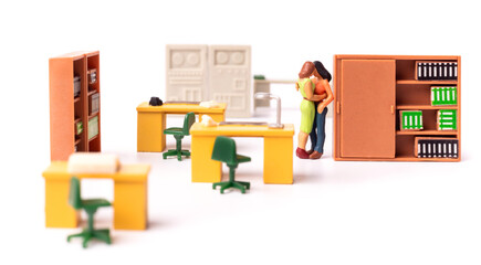 Miniature people female couple. Love at the office