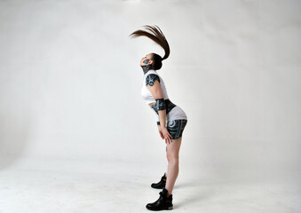 beautiful girl in robes looks and plays with her hair