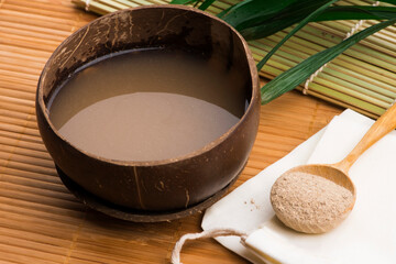 Kava drink made from the roots of the kava plant mixed with water - obrazy, fototapety, plakaty