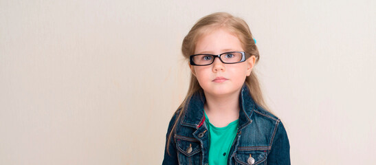 Little girl in eyeglasses. Vision, school, education and people concept.