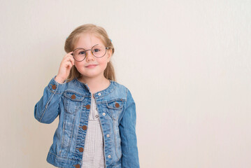 Little girl in eyeglasses. Vision, school, education and people concept.
