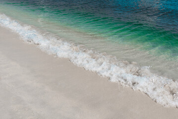 Beautiful transparent turquose water and white sand background. Tropical summer concept layout. 