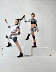 Obraz premium beautiful girls in robes look at each other and touch their hair