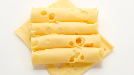 sliced cheese with holes. gold Swiss cheese. macro shot
