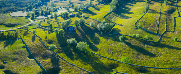 Landscape of meadows, Pasiegas Cabins and stone walls in the Portillo de la Sia. Comarca de Las Merindades in the province of Burgos. Autonomous Community of Castilla y Leon