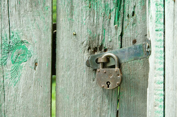 The old padlock on the old gate