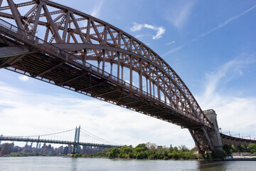The Hell Gate Bridge over the East River with the Triborough Bridge in the Background in New York City