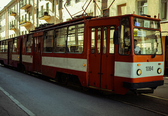 Obraz na płótnie Canvas Saint Petersburg/ Russia 23.06.2020:old tram in the city center on a narrow street near residential buildings 
