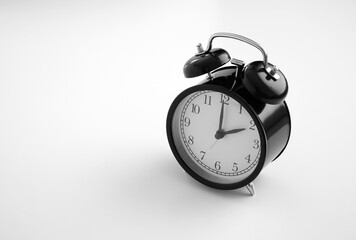 Black vintage alarm clock on table. White background. Wake up concept. An image of a retro clock showing 02:00 pm/am. 
