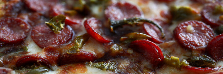 Fresh baked pizza with crusty cheese and hot tasty pepperoni ready to eat