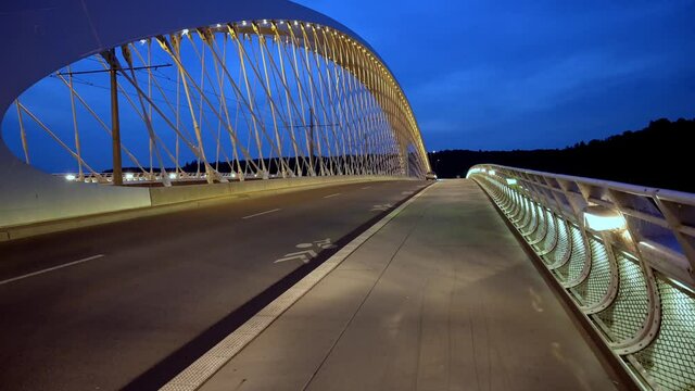 A car crosses the Troja Bridge, Prague at night