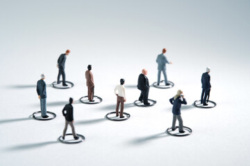 The new normal, people go to work maintaining physical distance in the crowd. Miniature people conceptual photography