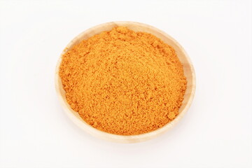 Marinated chicken seasoning in a wooden bowl