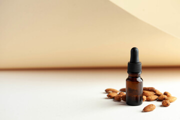 Serum oil for the face with almonds, with a place for text entry. Skin care. Almond Extract...