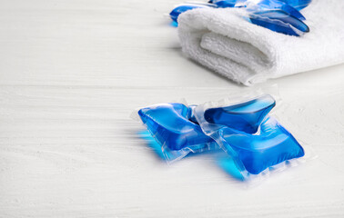 Detergent washing pods and clean bath towel