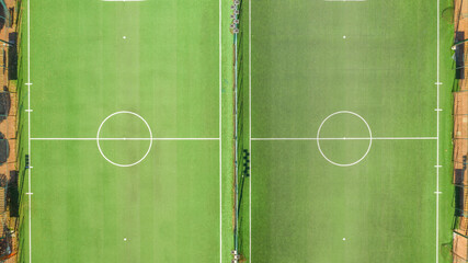 Aerial view of two soccer fields with synthetic grass during a sunny day