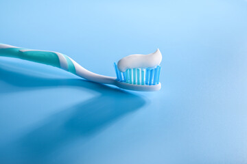 Fototapeta na wymiar Plastic toothbrush with toothpaste