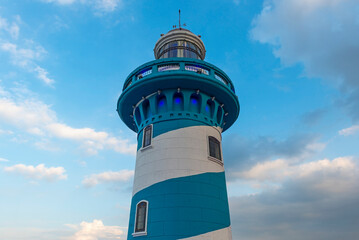 The blue and white lighthouse on top of Santa Ana hill and Las Penas district, Guayaquil, Ecuador.