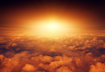 Aerial view of sun above the clouds