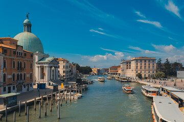 Fototapeta na wymiar Grand canal in Venice, Italy, with traffic of boats, during a sunny day with clear sky in summer