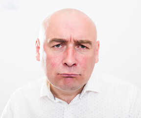 Fototapeta premium portrait of bald adult mature man with emotions on white background