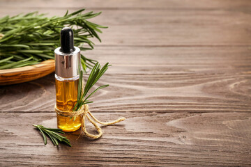 Aromatic rosemary oil and rosemary sprigs