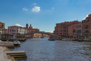 View of a bridge over the grand canal in Venice, Italy, with boats