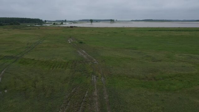 Flooded plain countryside landscape and river from drone pov