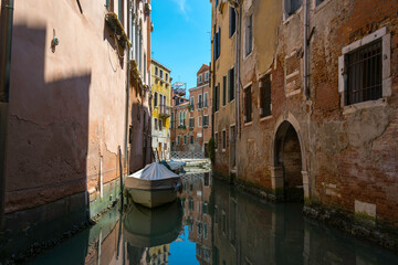 View of a boat on a small canal in Venice, Italy