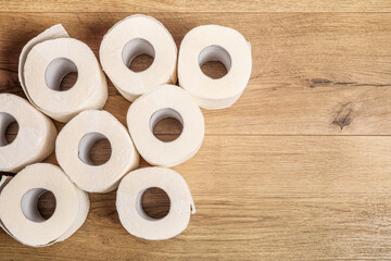 Toilet paper rolls pattern on wooden floor