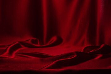 Red silk or satin luxury fabric texture can use as abstract background.