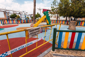 Signs that prohibit the use of a playground during de-escalation due to coronavirus. Posters:...