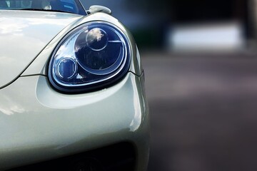 Obraz premium close up front view white sport car with big headlight