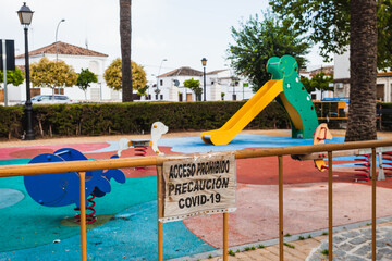 Signs that prohibit the use of a playground during de-escalation due to coronavirus. Posters:...