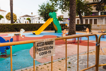 Signs that prohibit the use of a playground during de-escalation due to coronavirus. Posters:...
