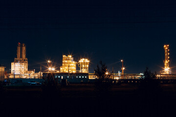 Fototapeta na wymiar Petrochemical Factory Plant with lights at night