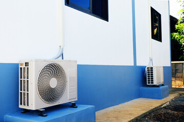 show position of Air conditioner installed outside of home with cement base