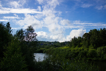 Fototapeta na wymiar Beautiful nature, river, green forest and blue sky