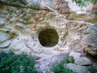 Gravina of Madonna della Scala. The gravina is a typical canyon of Puglia and Basilicata with cave dwellings carved into the rock and rock churches, Massafra, Apulia, Italy