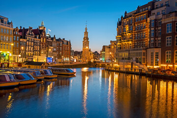Cityscenic from Amsterdam in the Netherlands with the Munt tower at sunset