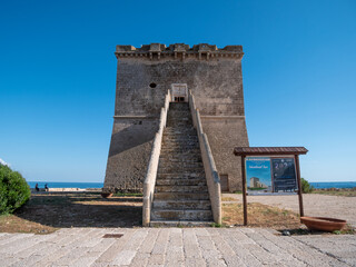 Picturesque historical fortification tower Torre Colimena on Salento Ionian sea coast, Taranto, Puglia, Italy