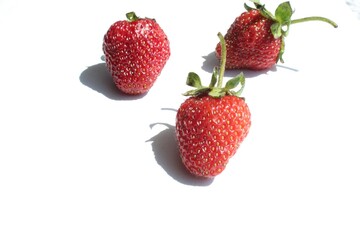 berries fruits useful strawberries three pieces halves on a white background with a place to insert...
