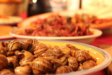 Piatto tipico siciliano di lumache al pomodoro