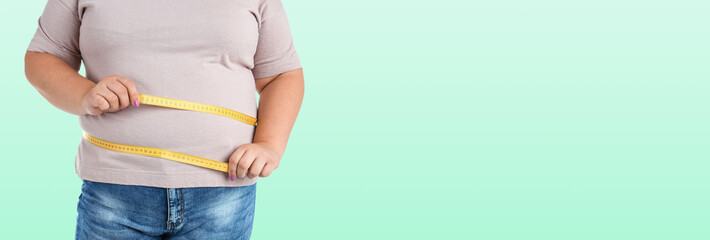 Closeup view of overweight woman with measuring tape on light green background, space for text....