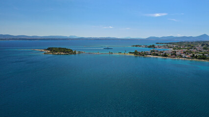 Aerial drone photo of famous island of dreams or Pesonisi connecting with small road with seaside fishing village of Eretria, Central Evia island, Greece