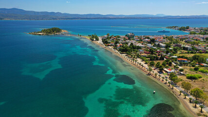 Aerial drone photo of famous island of dreams or Pesonisi connecting with small road with seaside fishing village of Eretria, Central Evia island, Greece