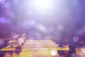 Fighting game of chess competition In white sun light on bokeh background