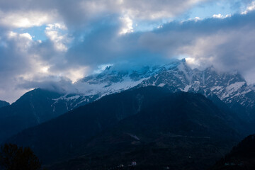 mountain peak and blue clouds in the morning 