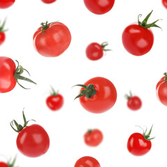 Set with delicious ripe cherry tomatoes falling on white background
